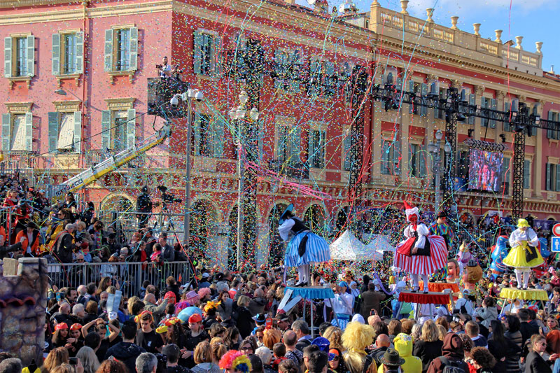 Nice Carnival, thousands of streamers and confetti fall on a lively crowd in the city centre