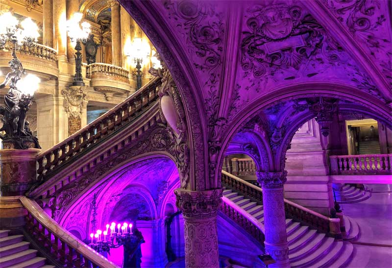 The central staircase of the Paris Opera House lots of gold, candles and statues