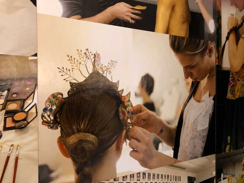 Ballerina having her hair dressed in preparation for a performance at Opera Garnier